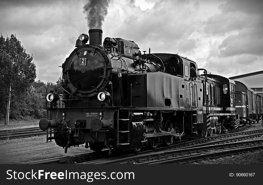 Train On Railroad Tracks Against Sky