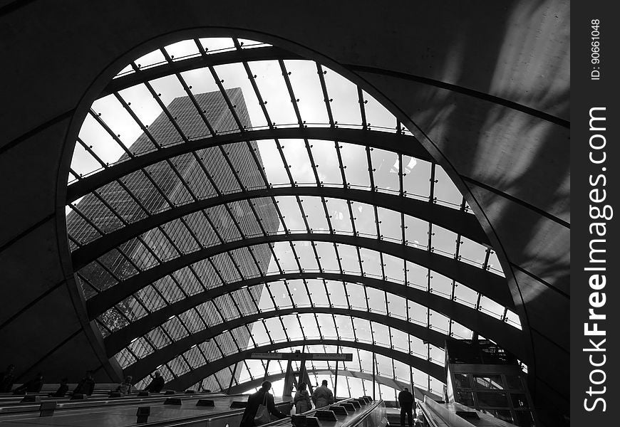 Skylight in contemporary building showing skyline of city in black and white.