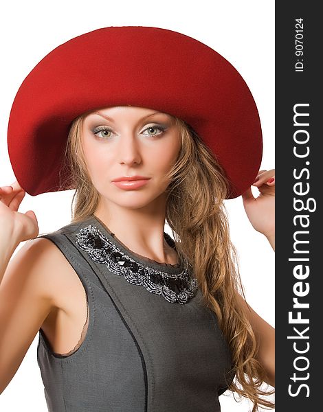 Beautiful young female in red hat isolated over white with clipping path