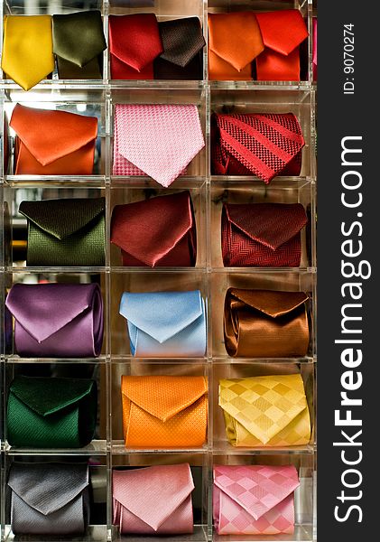 Shelf full of fine silk neckties in a Italian textile store. Shelf full of fine silk neckties in a Italian textile store