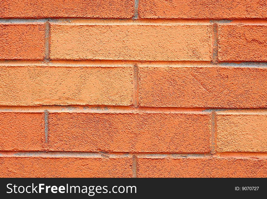 Orange bricks in the wall can be used as background