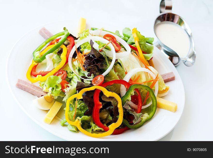 Delicious vegetable salad serve in white creamy sauce