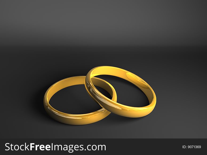 Two golden rings on dark gray background