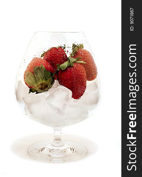 Strawberries in the wet glass isolated on white background