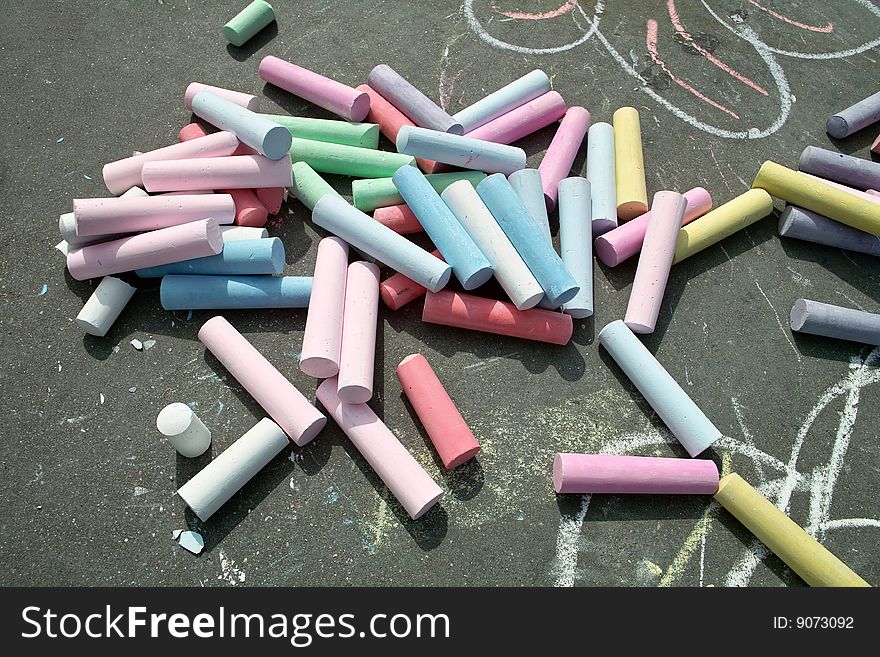 Colorful sticks of chalk ready to make beautiful sidewalk art. Colorful sticks of chalk ready to make beautiful sidewalk art