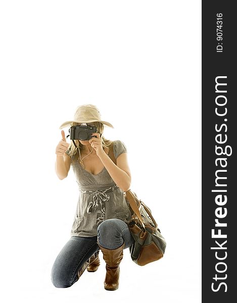 Happy woman going on vacation with passport and her suitcase over a white background