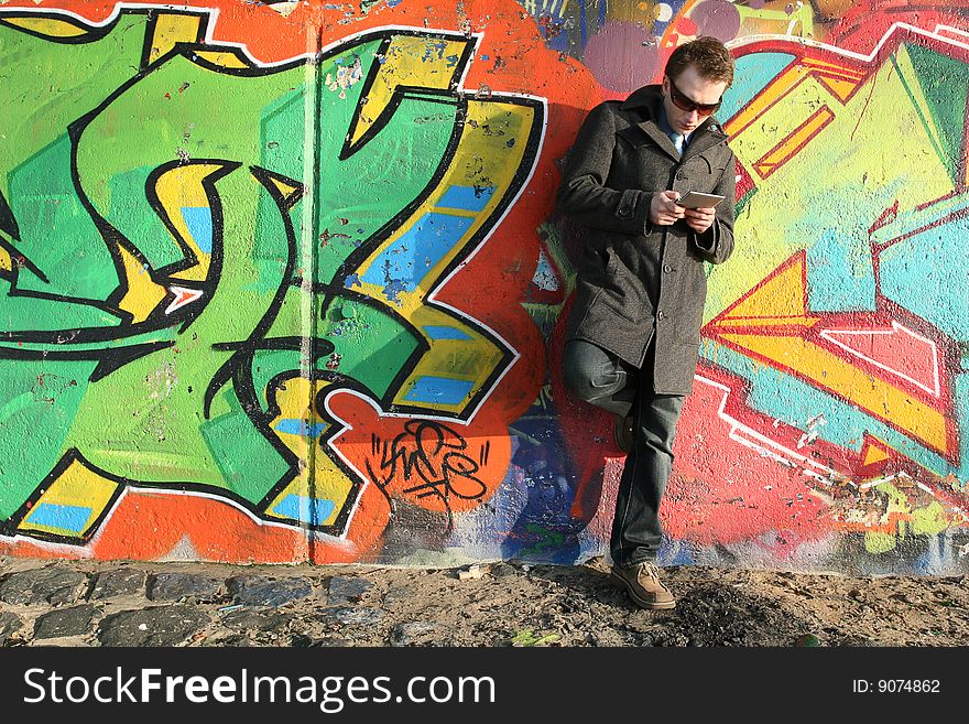 Man working with his pager outdoor. Man working with his pager outdoor