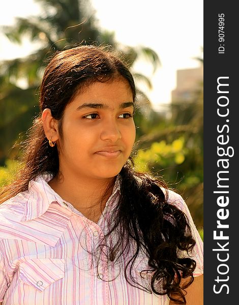 A young Indian girl paying a close attention. A young Indian girl paying a close attention.