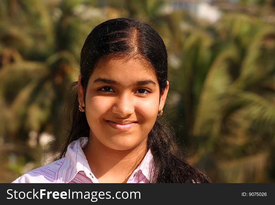 A young Indian girl with a innocent face and lovely smile. A young Indian girl with a innocent face and lovely smile.