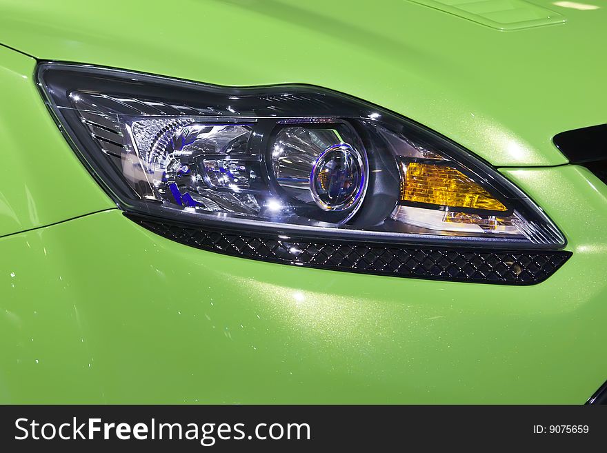 Headlight bumper of a green sport car
