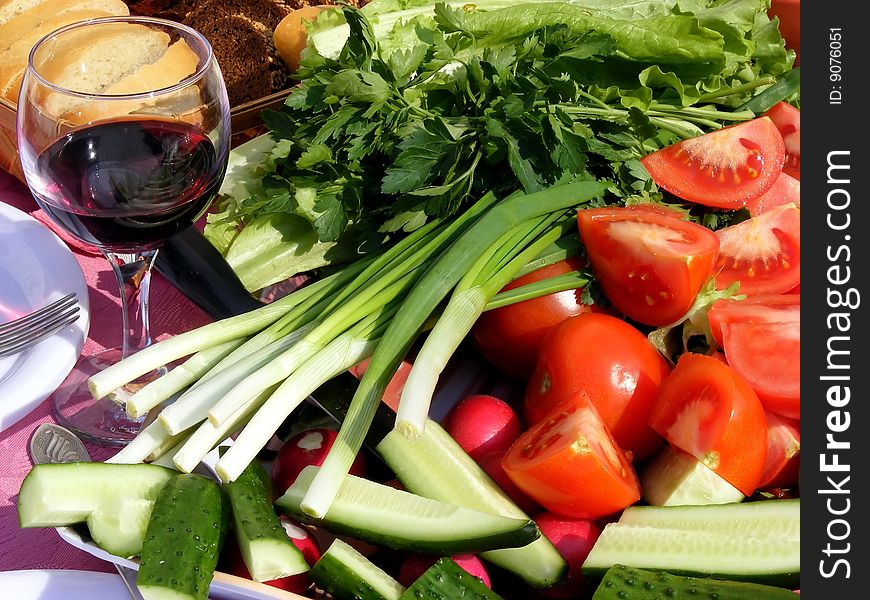 Still life of fresh vegetables - tomatoes, cucumbers, onions on the table. Still life of fresh vegetables - tomatoes, cucumbers, onions on the table