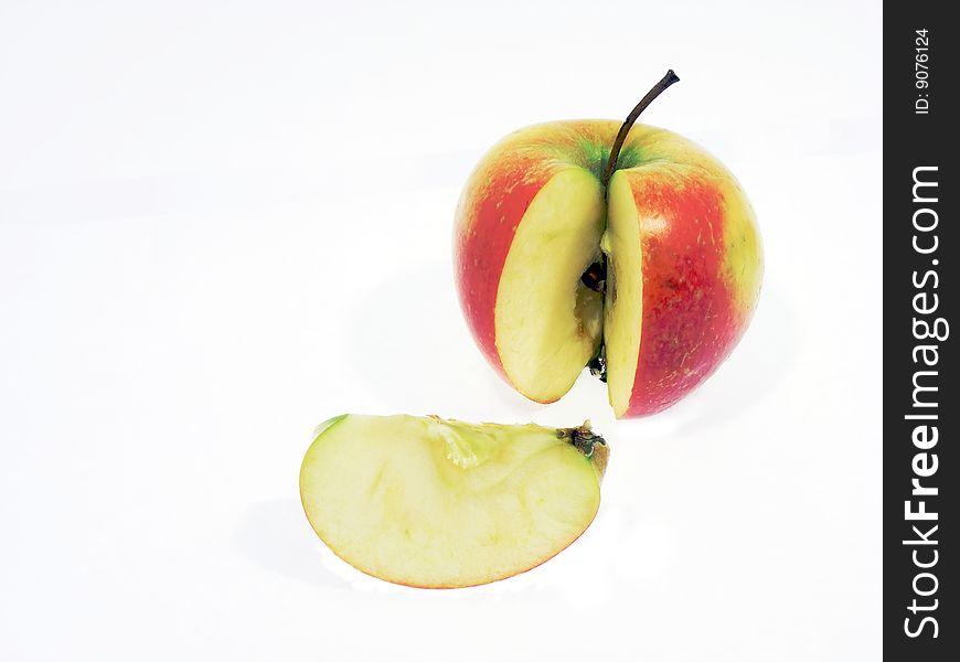 The ripe red apple and slice it with the seeds