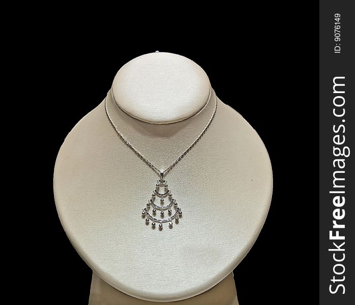 A beautiful necklace on an isolated background around a model neck.