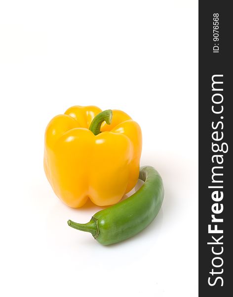 Yellow bell pepper with green Anaheim pepper. Yellow bell pepper with green Anaheim pepper