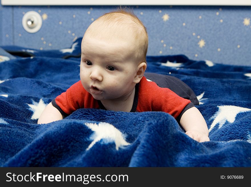 Beautiful little baby portrait on blue background. Beautiful little baby portrait on blue background