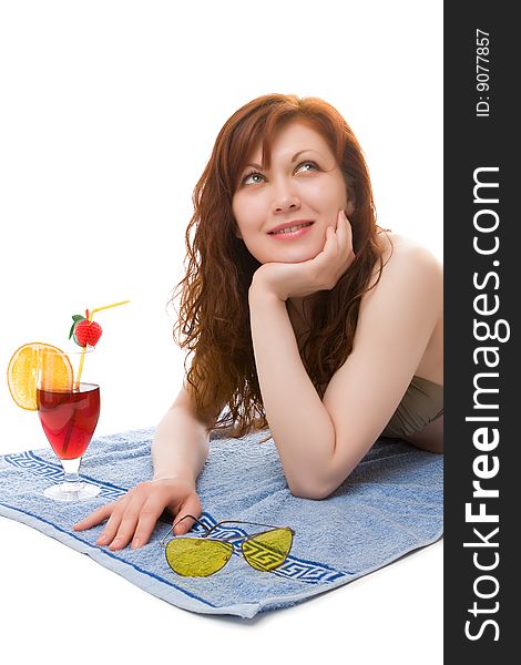 Beautiful girl on a beach towel with a cocktail. Beautiful girl on a beach towel with a cocktail