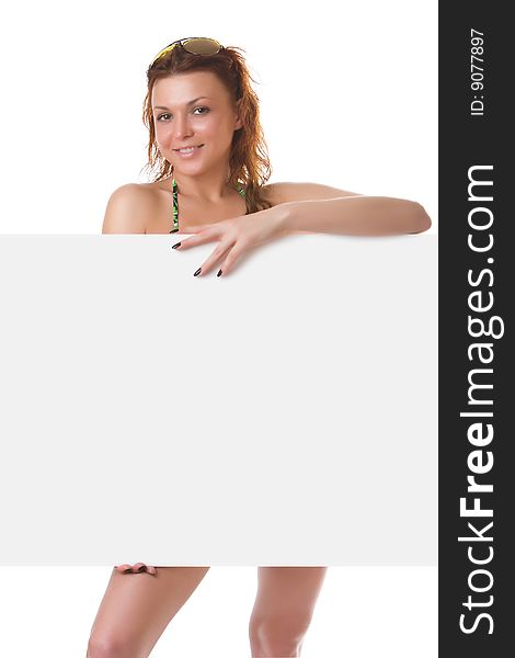 Undressed girl with a clean sheet in hands isolated on a white background. Undressed girl with a clean sheet in hands isolated on a white background