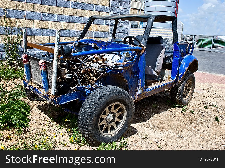 Old abandoned rusted field car