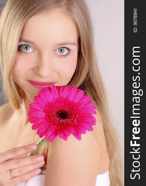 Girl's face and pink flower. Girl's face and pink flower
