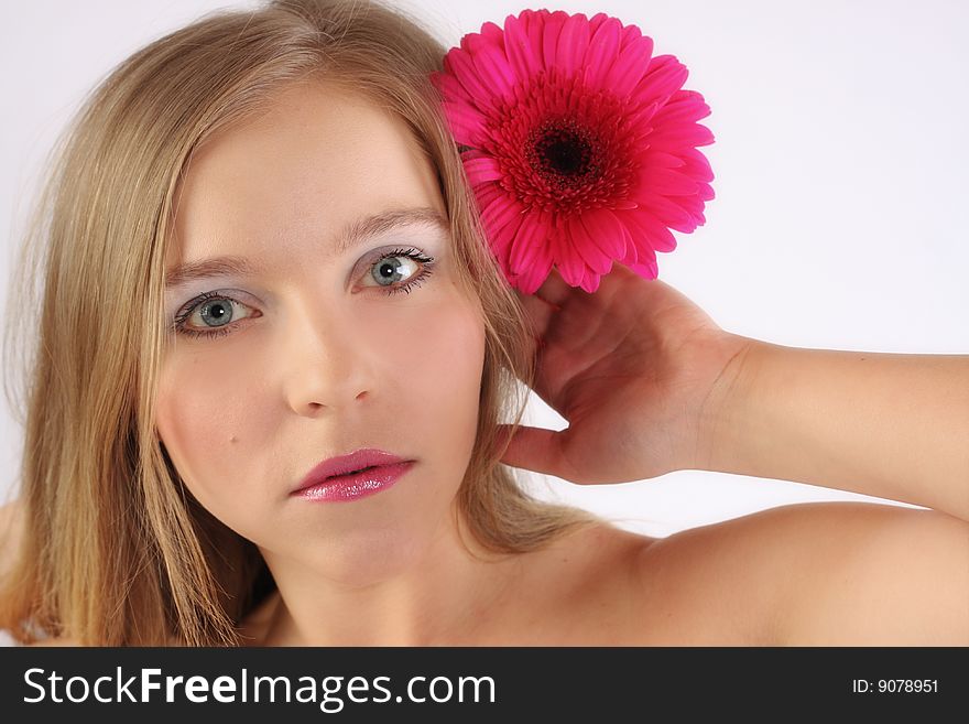 Girl's face and pink flower. Girl's face and pink flower