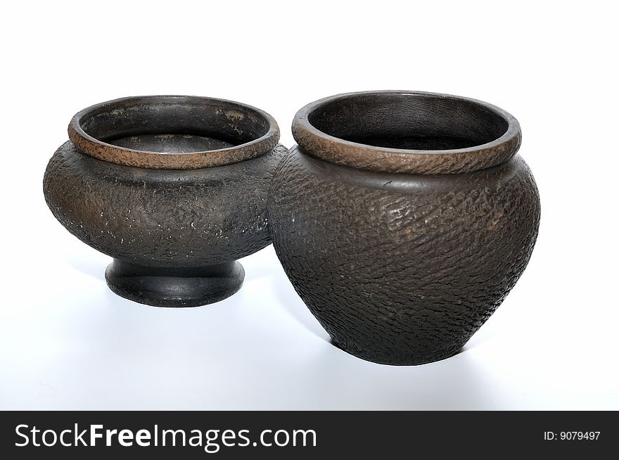 Two small black ceramic vases