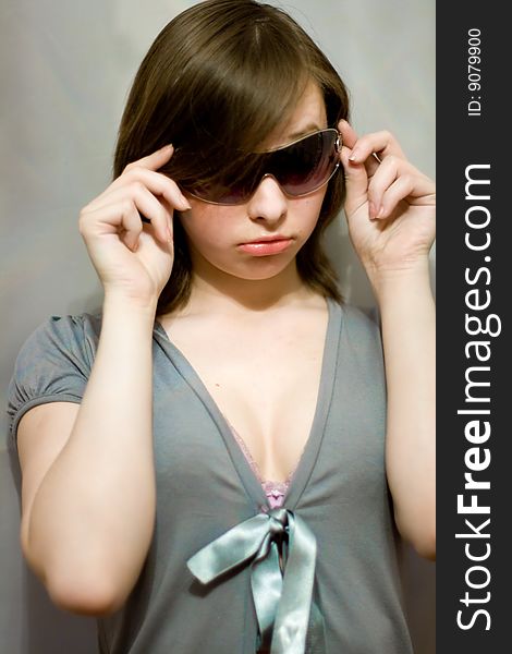 Beautiful glamorous girl in blue and in dark sunglasses. Beautiful glamorous girl in blue and in dark sunglasses