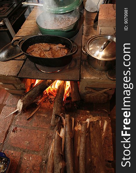 Cooking meat with iron pot. Cooking meat with iron pot
