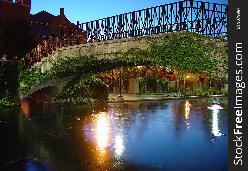 A bridge spanning a canal in the evening. A bridge spanning a canal in the evening.