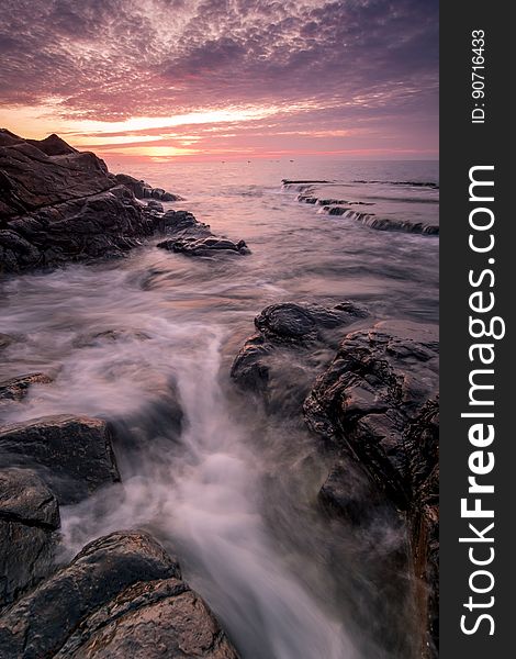 Running Water With Rock Formation during Golden Hour