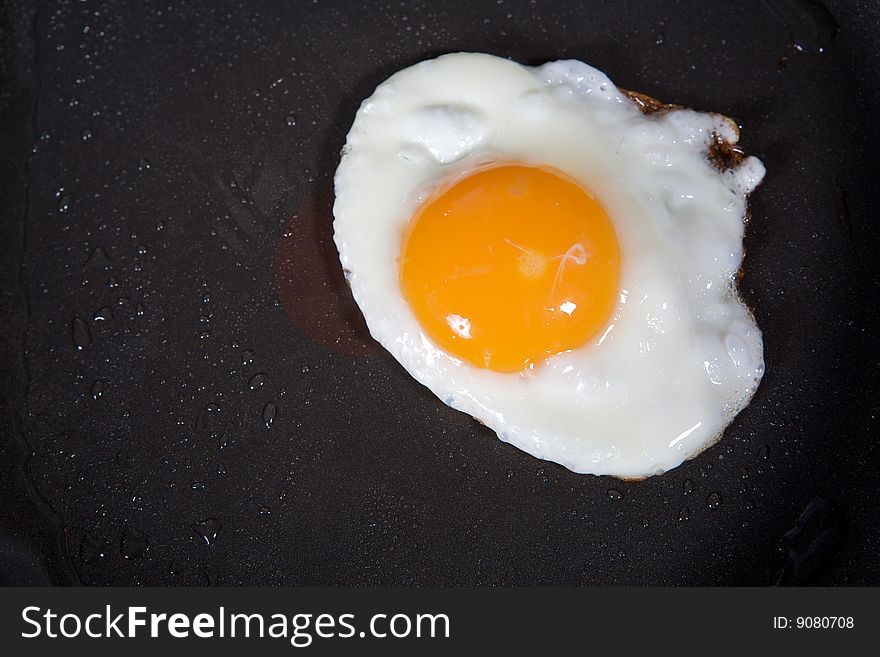 A fried egg in a frying pan. A fried egg in a frying pan.