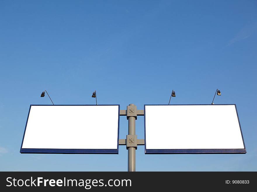 Two blank billboard on a clear blue sky. Two blank billboard on a clear blue sky.