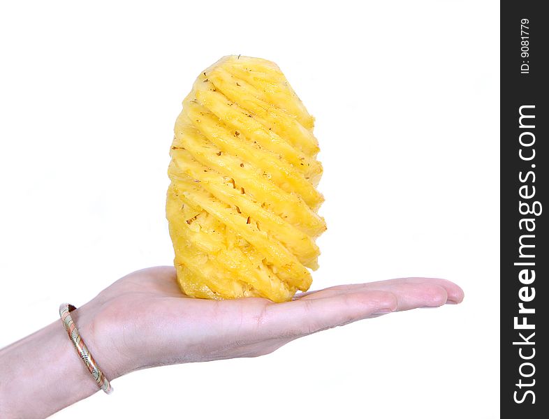 Hand holding a freshly cut pineapple on white background. Hand holding a freshly cut pineapple on white background