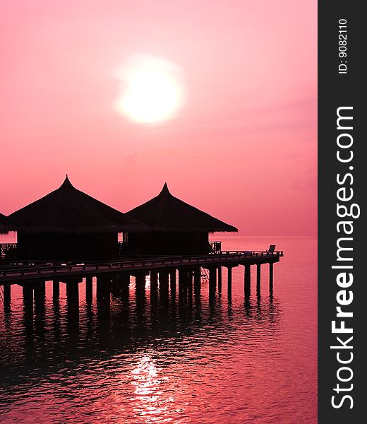 Water bungalows and sunset