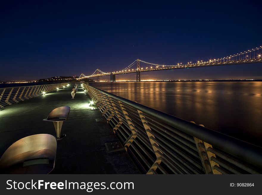 San Francisco Bay bridge at night, long exposure resulted in silky smooth water