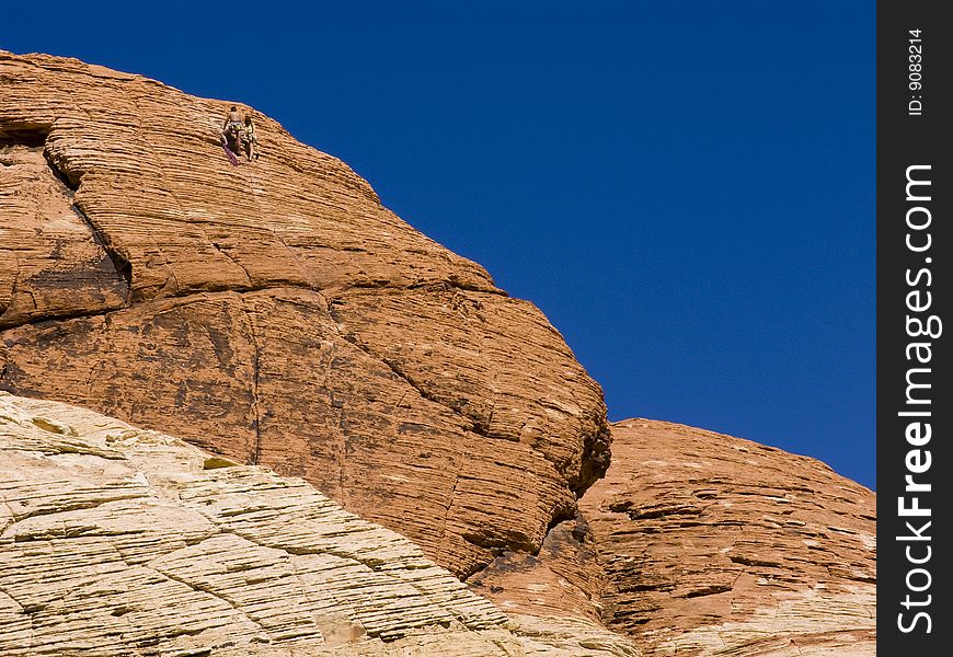 A team of climbers climbing at Red Rock canyon in Nevada.