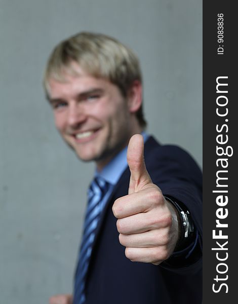 Young man with high thumb