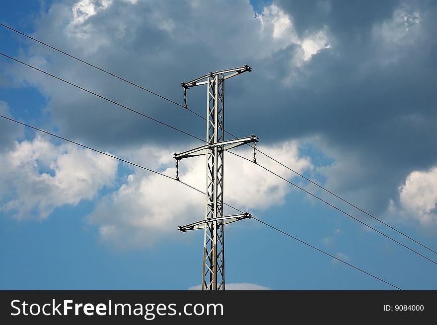 Photo of transmission pole with clouds