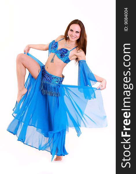 Nice dancing woman in blue dress isolated over white. Nice dancing woman in blue dress isolated over white