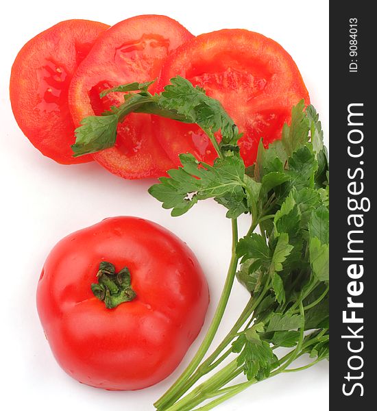 Sliced fresh red tomatoes with green parsley