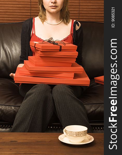 Beautiful young woman enjoying a cup of tea. Beautiful young woman enjoying a cup of tea