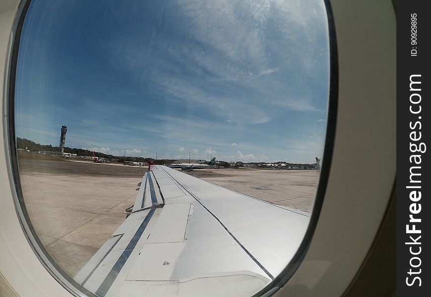 A view inside the plane on the runway at Aeroporto Internacional de Salvador in Bahia. A view inside the plane on the runway at Aeroporto Internacional de Salvador in Bahia.