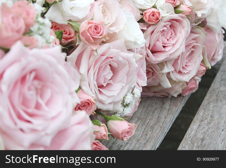 A close up of pale pink rose wedding bouquets.