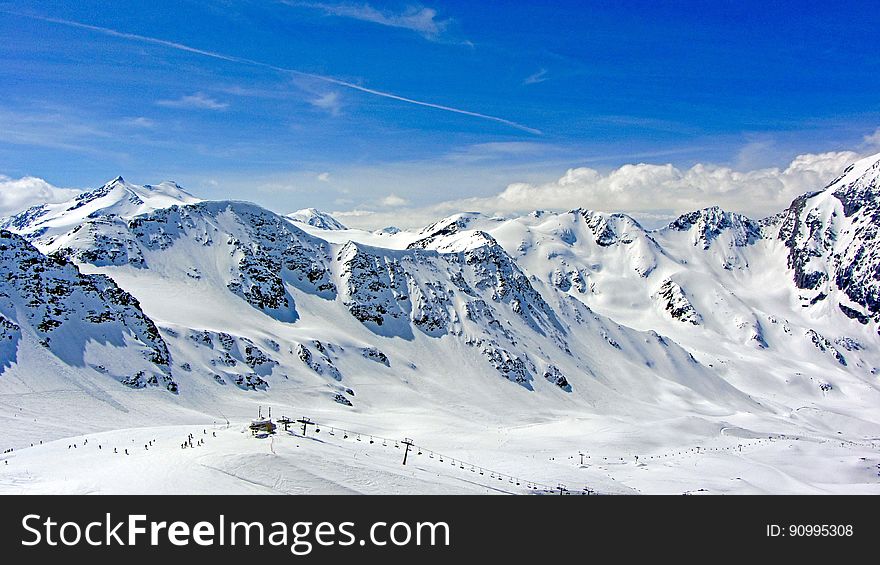 Mountain panorama in the winter with a ski resort on the slopes. Mountain panorama in the winter with a ski resort on the slopes.