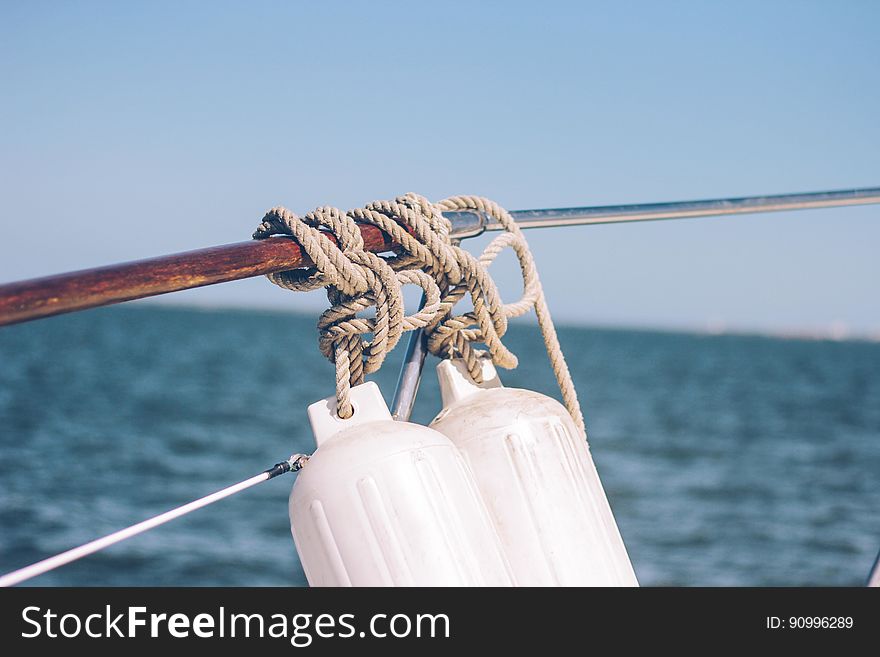 A pair of sleepers hanging from the side of a boat. A pair of sleepers hanging from the side of a boat.