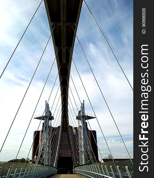 A view of a suspension bridge from the deck.