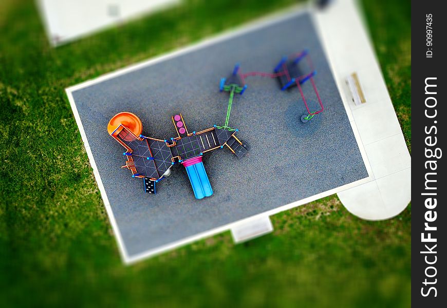 Aerial view of playground in park on sunny day.