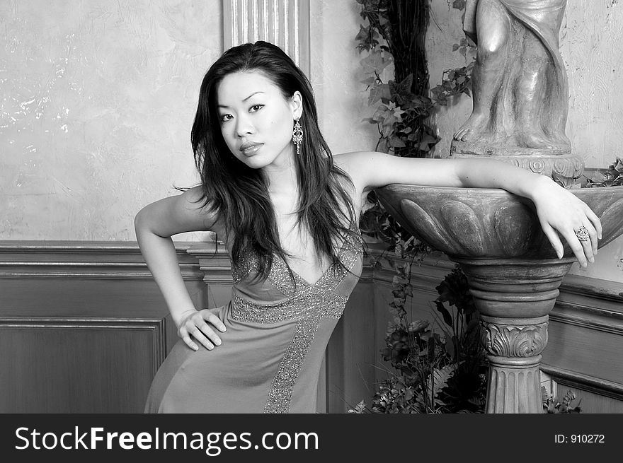 A Black & White image of a beautiful Asian model in an evening dress. A Black & White image of a beautiful Asian model in an evening dress.