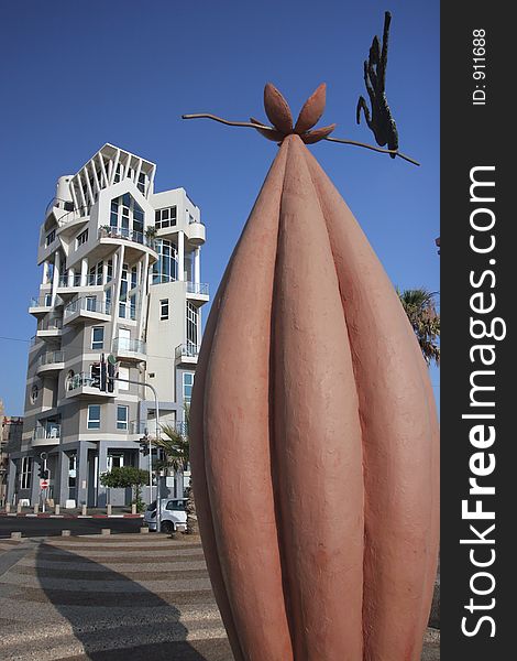 Strange coffee Bean and interesting apartment block on the beach Tel Aviv, Israel. Strange coffee Bean and interesting apartment block on the beach Tel Aviv, Israel