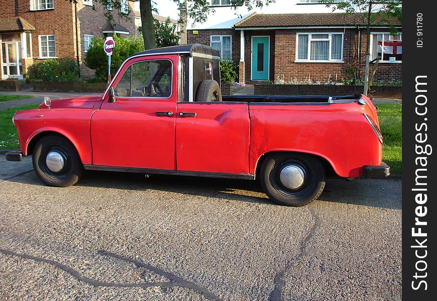 An antique pick up on a street in London subburb. An antique pick up on a street in London subburb
