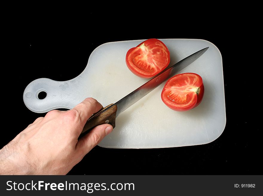 Two halves of a cut tomato.